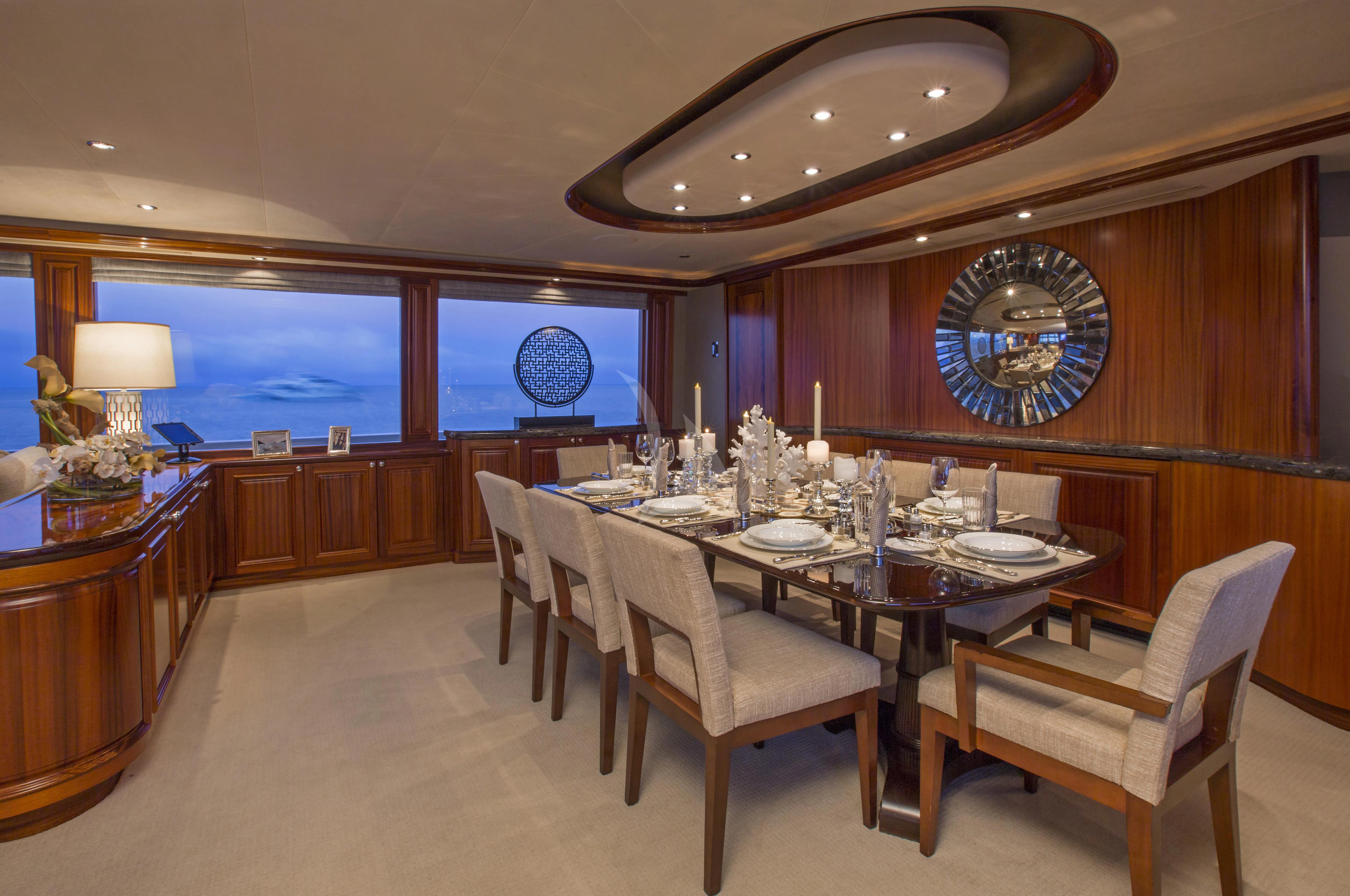 a large dining room with a large chandelier aboard ANTARES Yacht for Sale