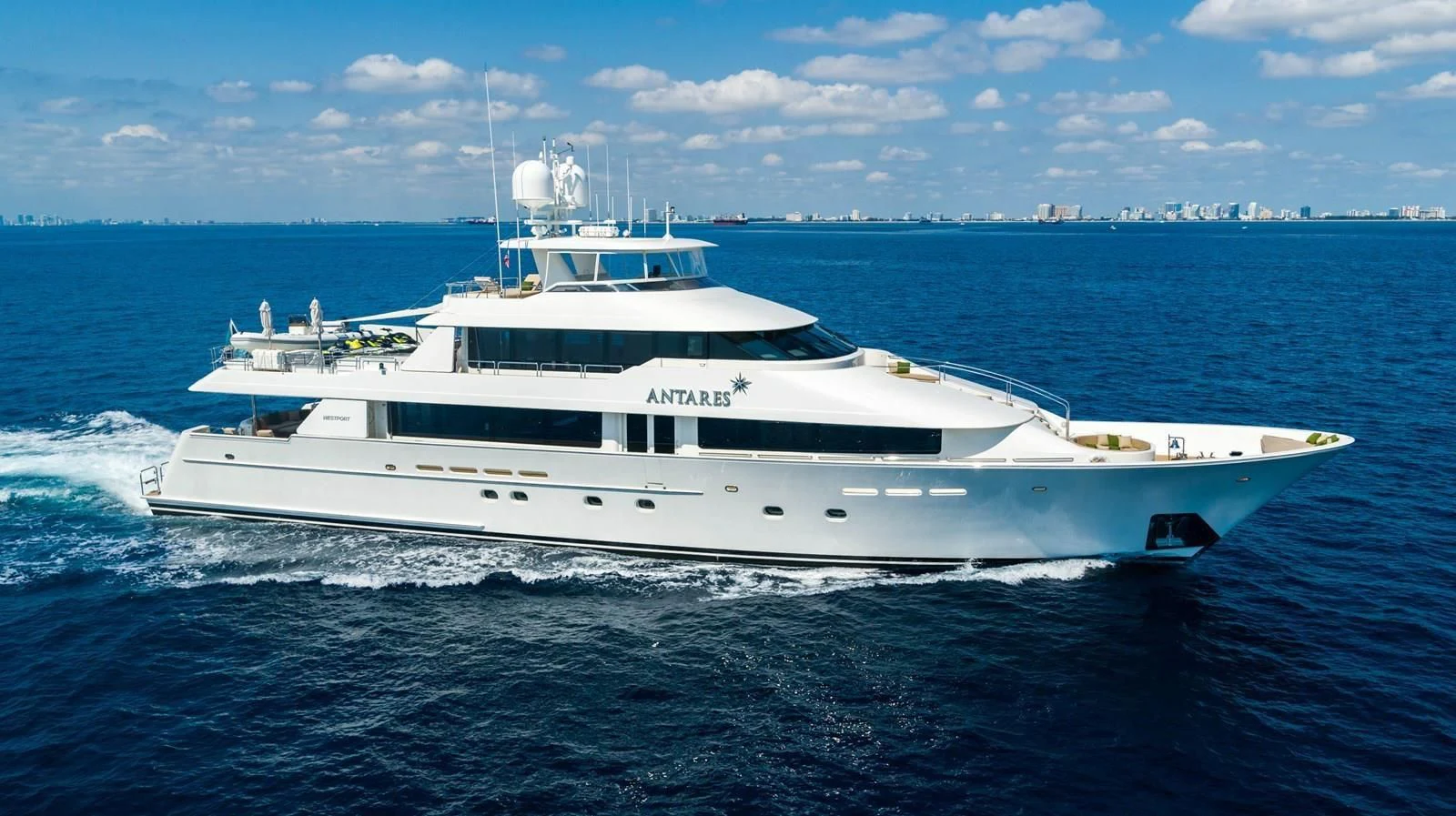 a white yacht in the water aboard ANTARES Yacht for Sale