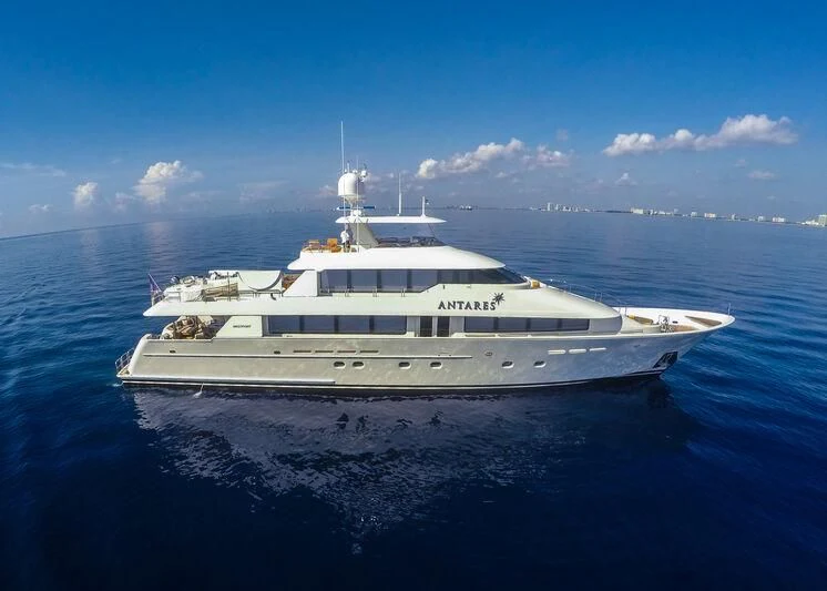 a large white yacht in the water aboard ANTARES Yacht for Sale