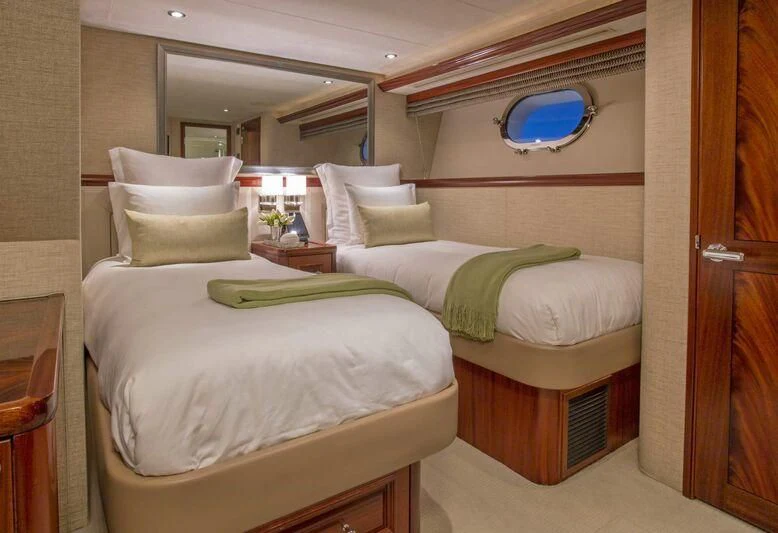a couple of beds in a room aboard ANTARES Yacht for Sale