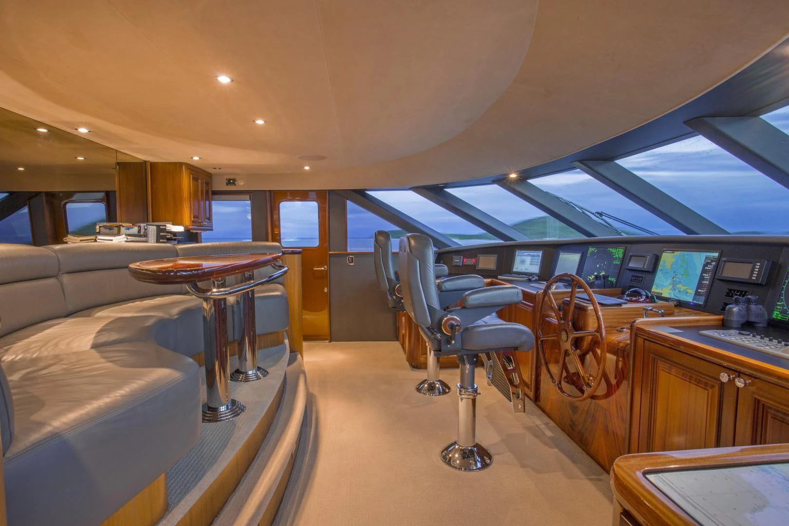 a room with tables and chairs aboard ANTARES Yacht for Sale