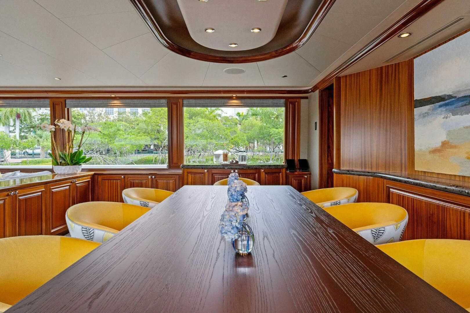 a dining table with a vase on it aboard ANTARES Yacht for Sale