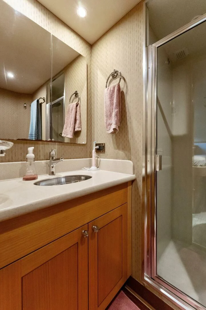 a bathroom with a sink and a mirror aboard ANTARES Yacht for Sale
