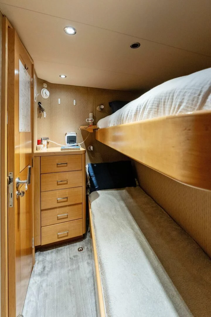 a bedroom with a bed and a closet aboard ANTARES Yacht for Sale