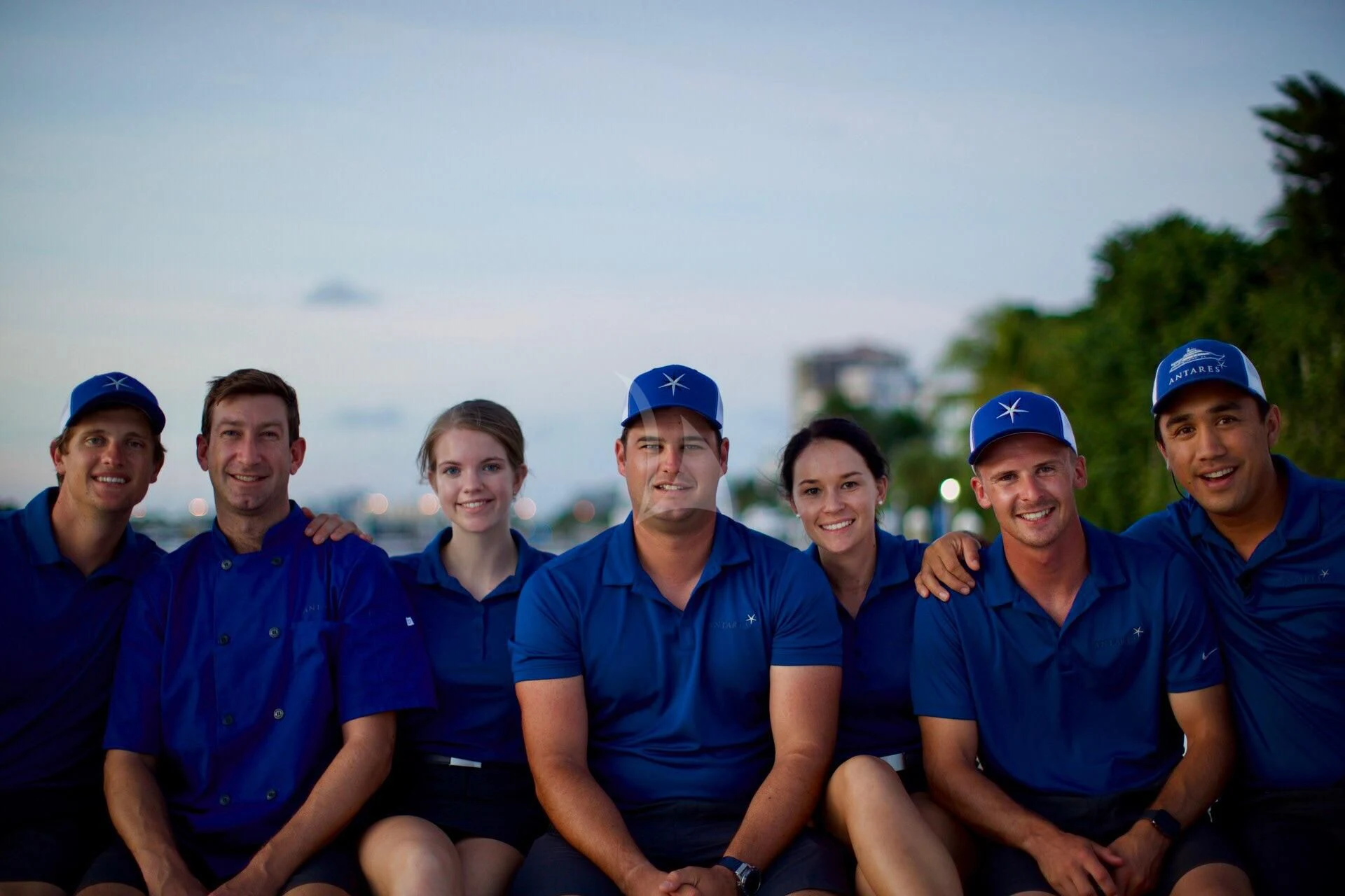 a group of people posing for a photo aboard ANTARES Yacht for Sale
