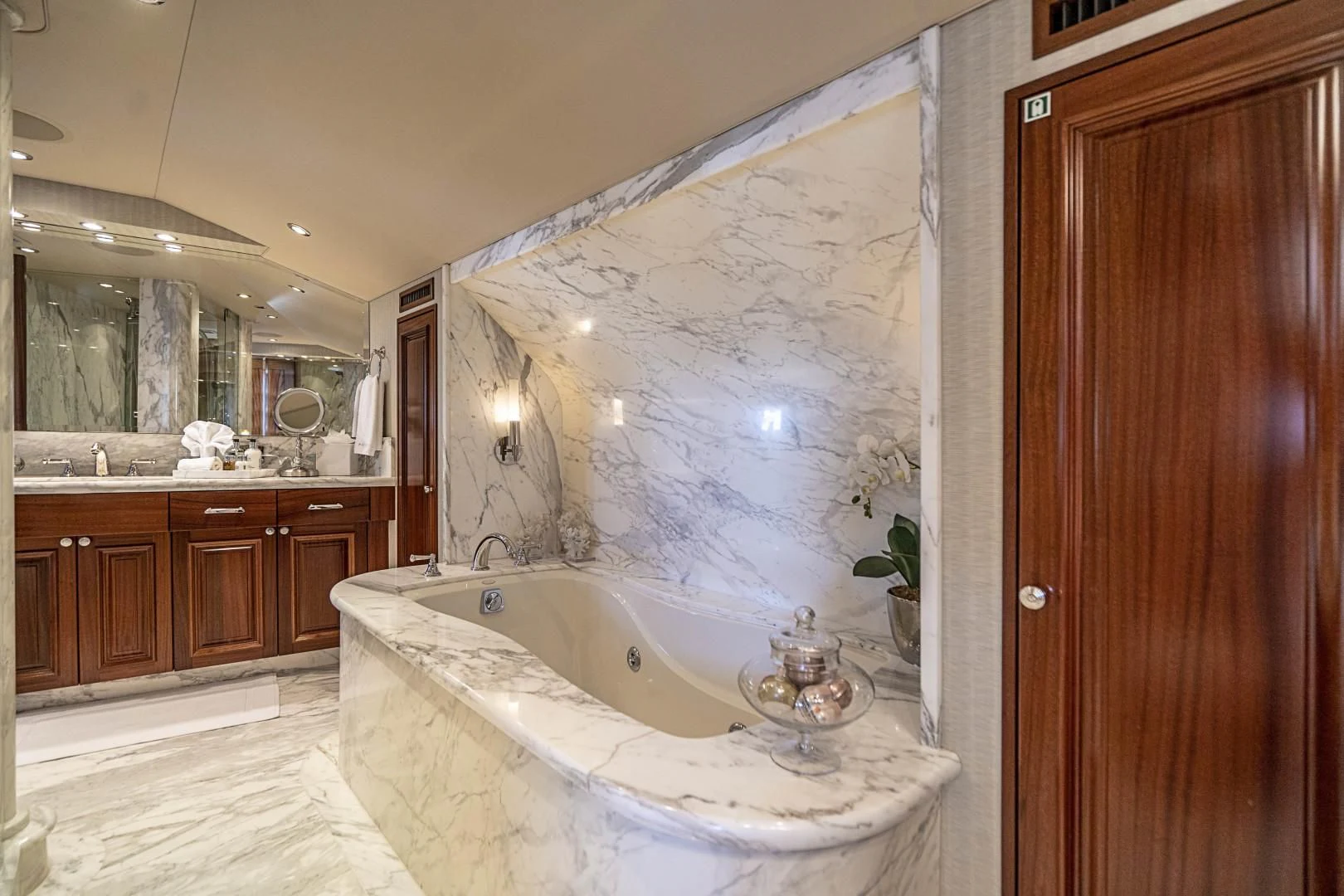a bathroom with a bathtub and sink aboard ANTARES Yacht for Sale
