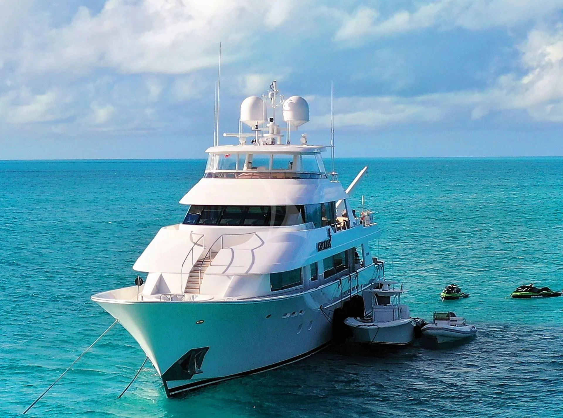 a white boat in the water aboard ANTARES Yacht for Sale