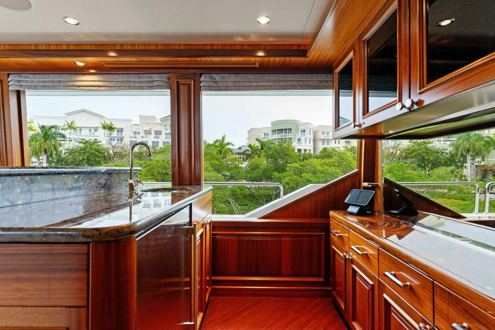 a kitchen with wooden cabinets aboard ANTARES Yacht for Sale