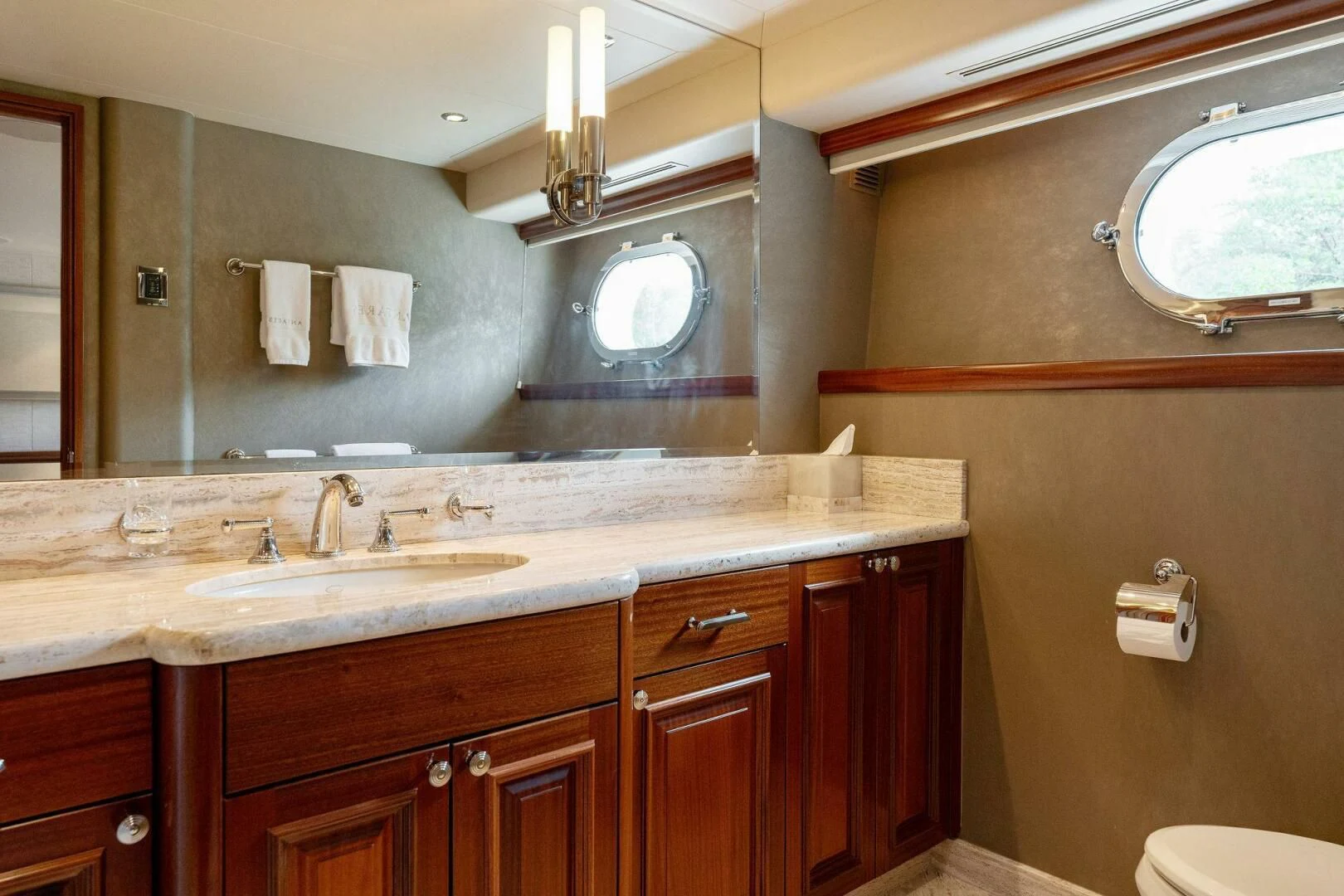 a bathroom with a sink and a mirror aboard ANTARES Yacht for Sale