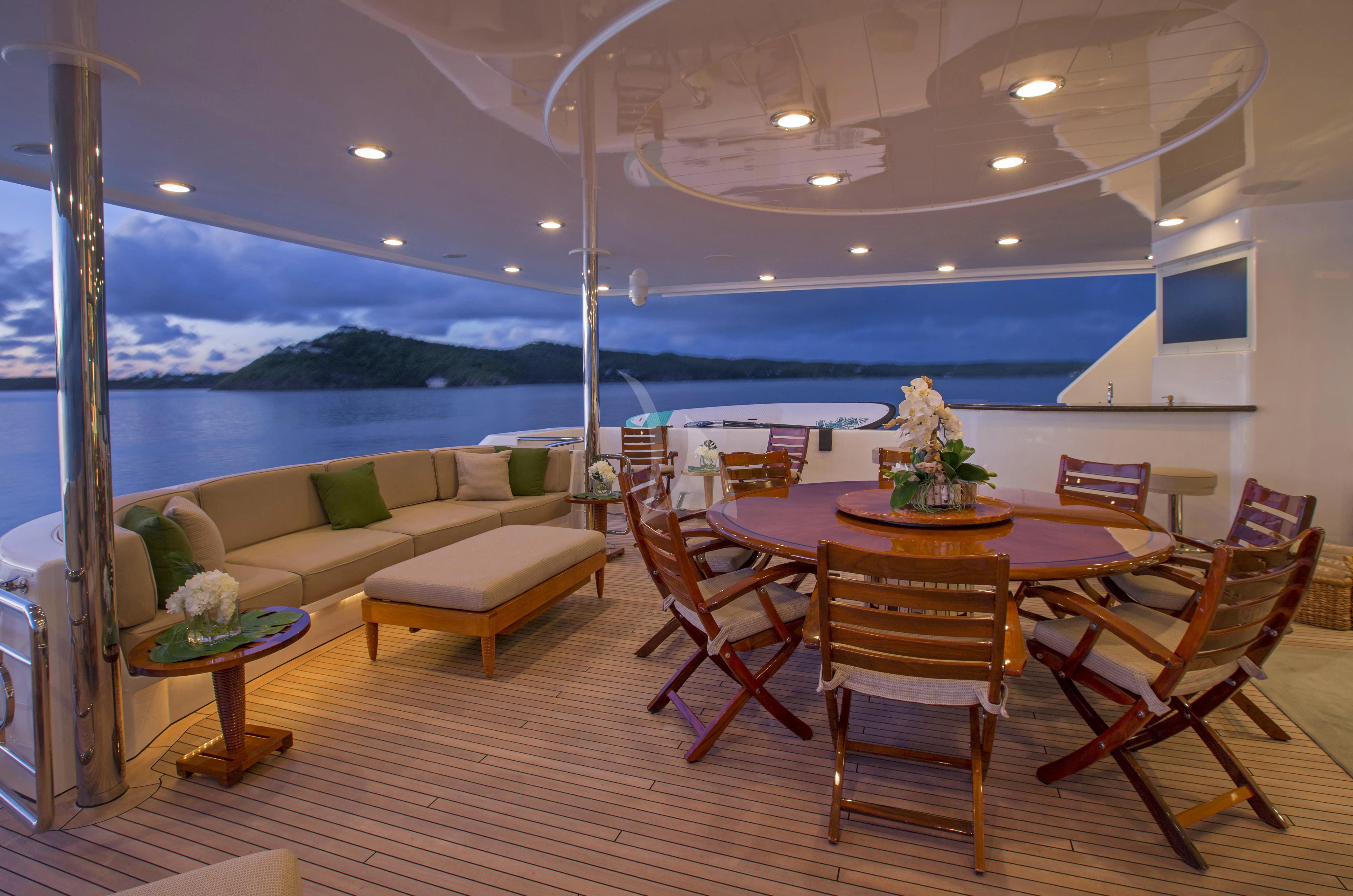 a living room with a table and chairs aboard ANTARES Yacht for Sale