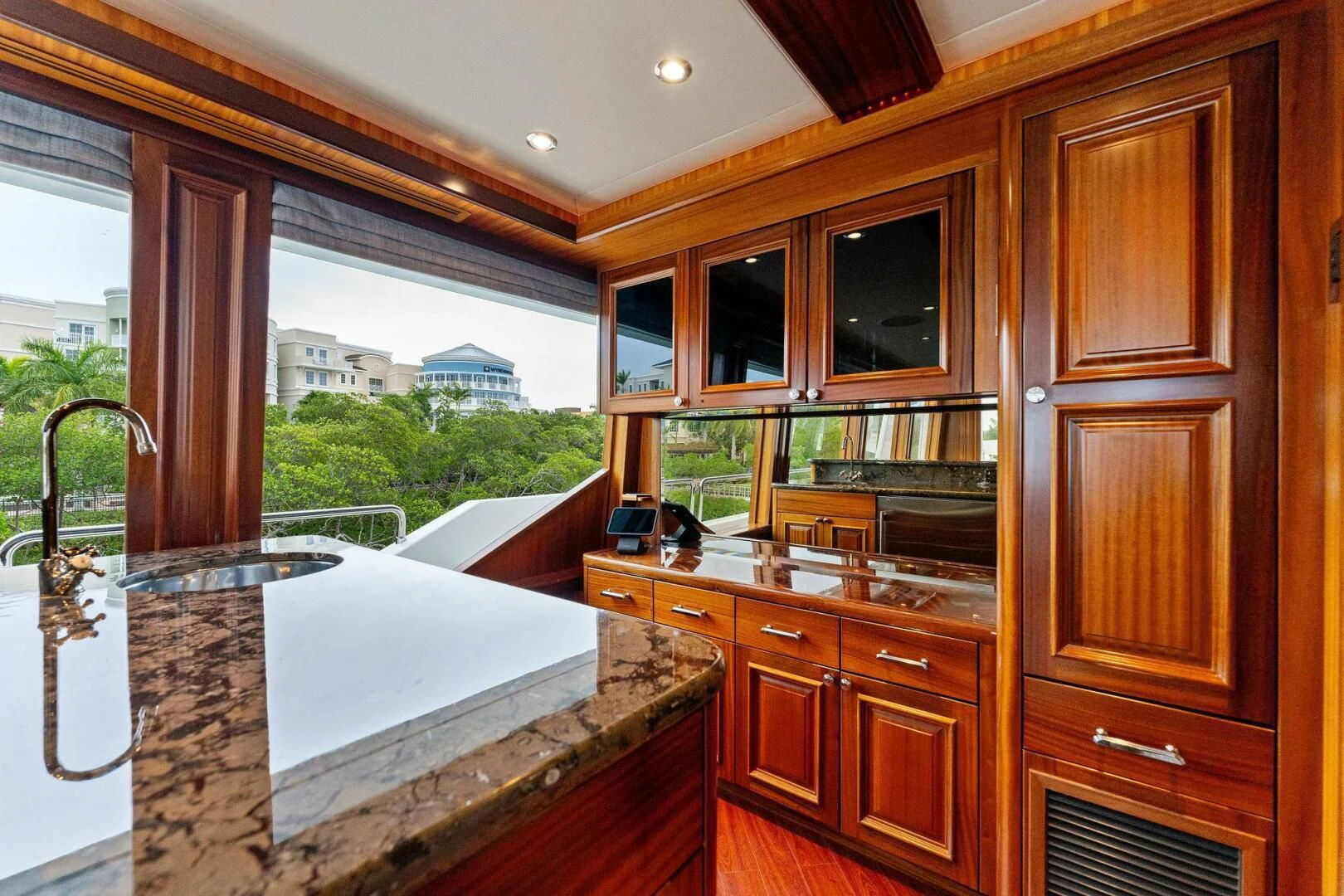 a kitchen with a large window aboard ANTARES Yacht for Sale