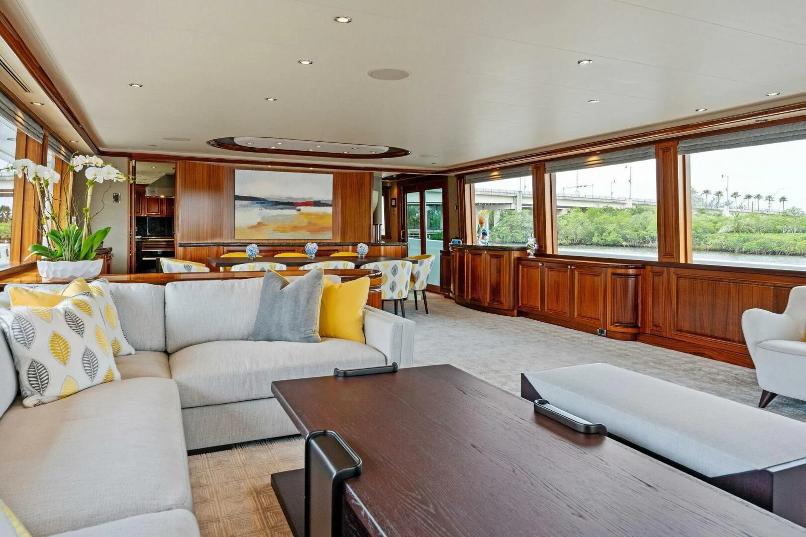 a living room with a table and couches aboard ANTARES Yacht for Sale