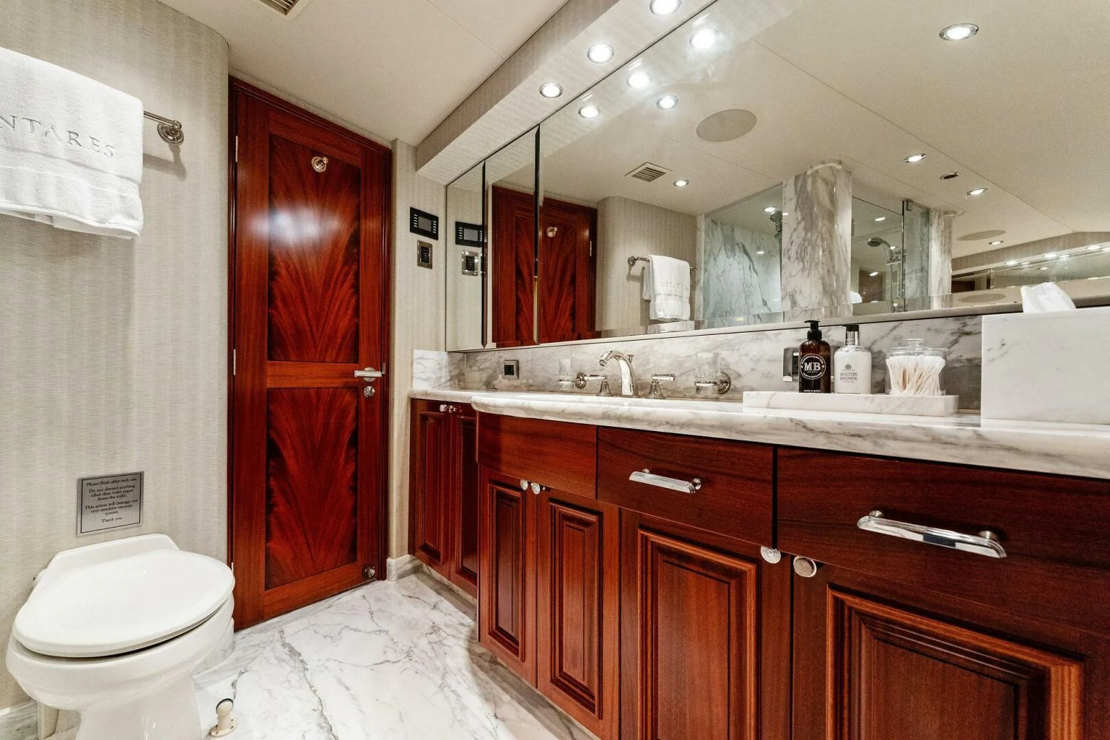 a bathroom with a large mirror aboard ANTARES Yacht for Sale