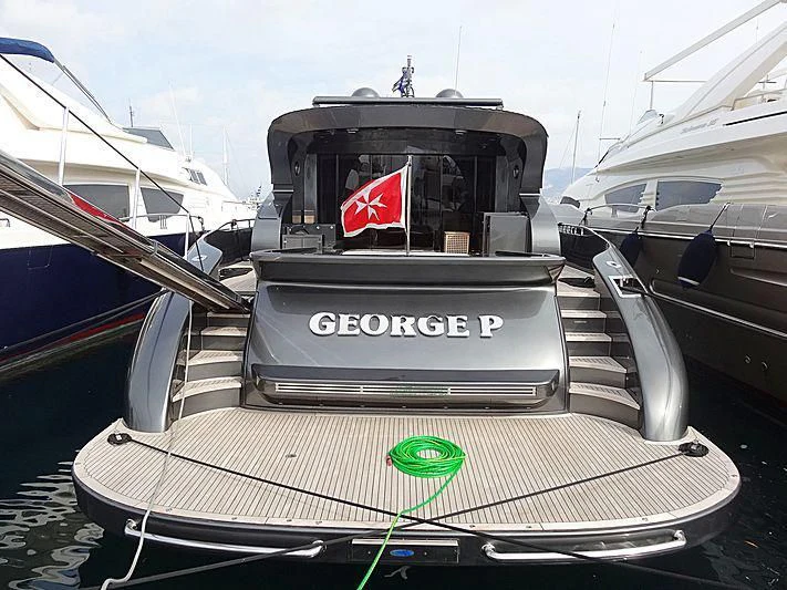 a boat with a flag on the front aboard EL DISPARO Yacht for Sale