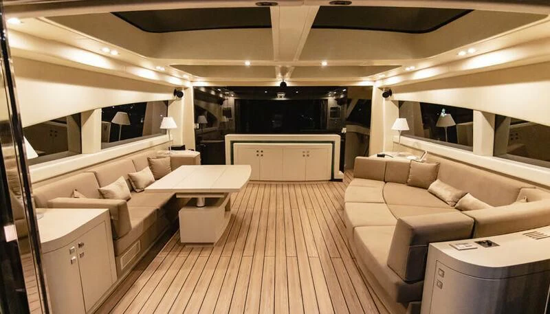 a room with a couch and a table aboard EL DISPARO Yacht for Sale