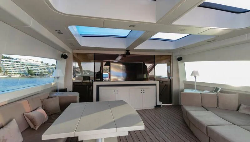 a room with a bed and a television aboard EL DISPARO Yacht for Sale