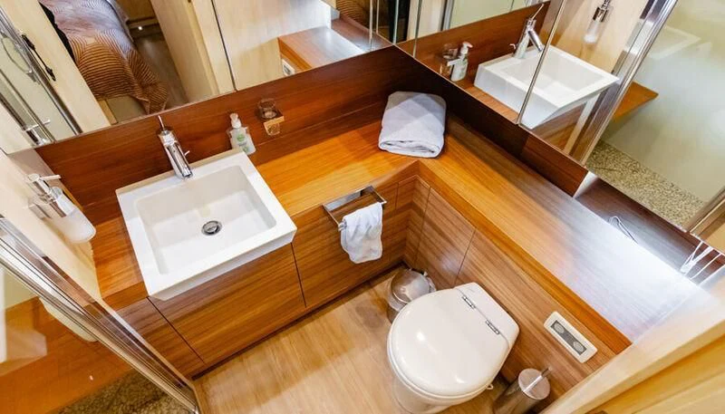 a bathroom with a sink and a mirror aboard EL DISPARO Yacht for Sale