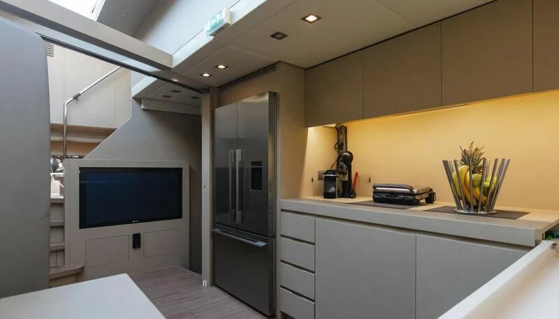 a room with a tv and a computer aboard EL DISPARO Yacht for Sale