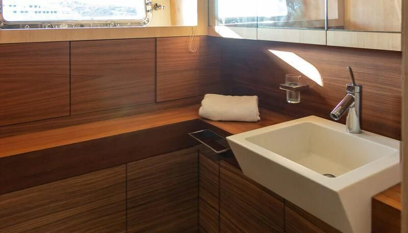 a bathroom with a sink and a mirror aboard EL DISPARO Yacht for Sale