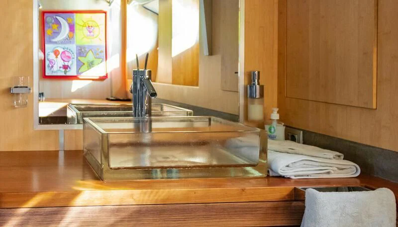 a kitchen with a sink and a mirror aboard EL DISPARO Yacht for Sale