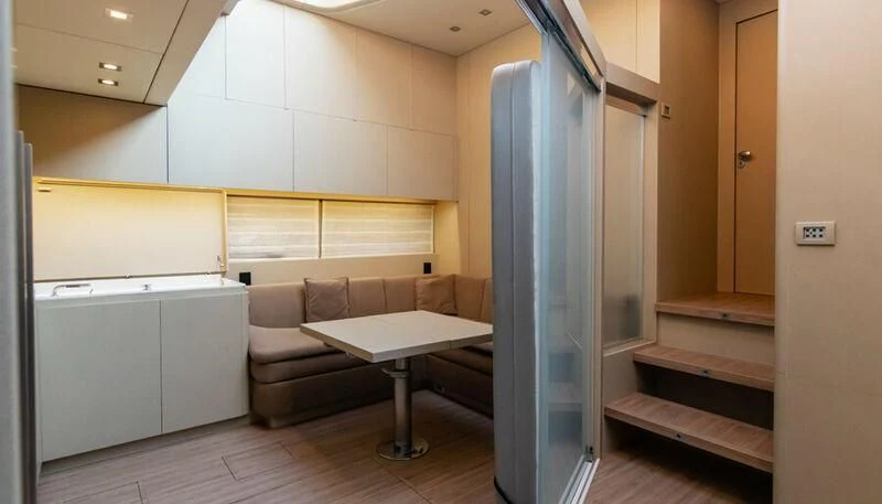 a room with a couch and a table aboard EL DISPARO Yacht for Sale