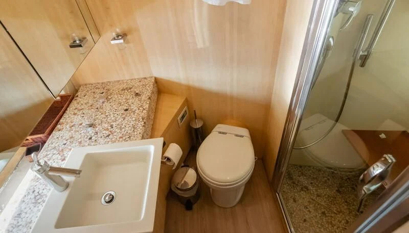 a bathroom with a sink toilet and a bathtub aboard EL DISPARO Yacht for Sale