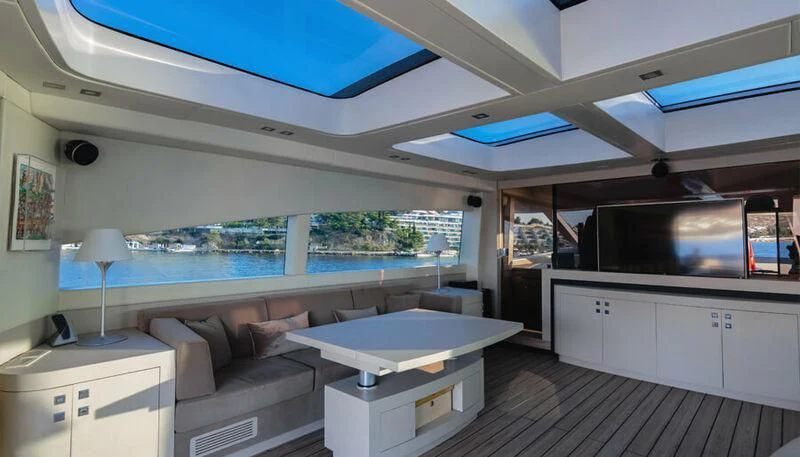 a room with a bed and a table aboard EL DISPARO Yacht for Sale