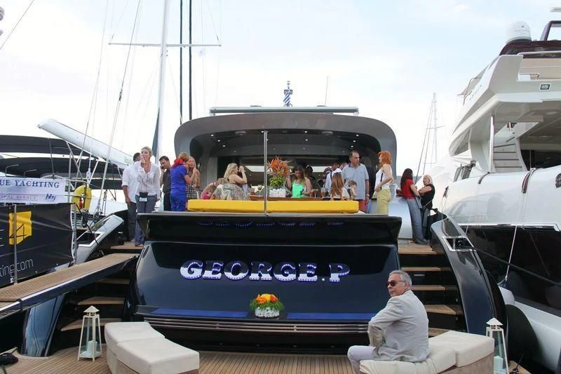 a group of people on a boat aboard EL DISPARO Yacht for Sale