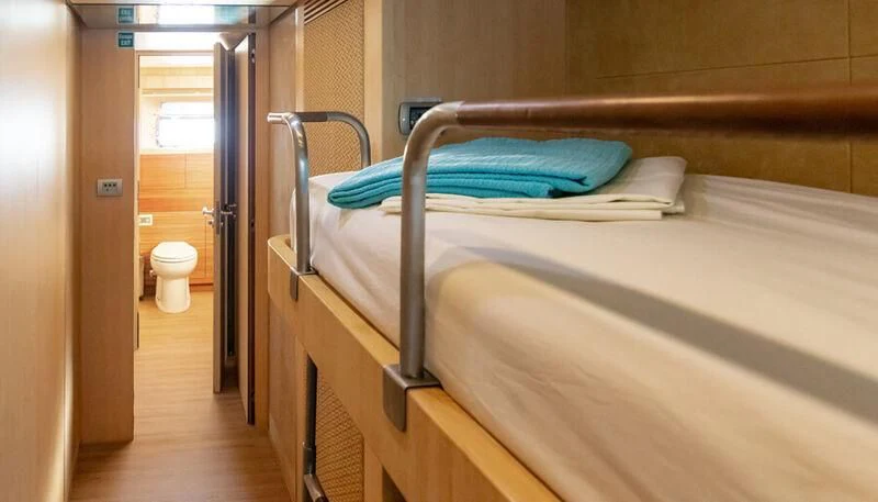 a bed in a room aboard EL DISPARO Yacht for Sale