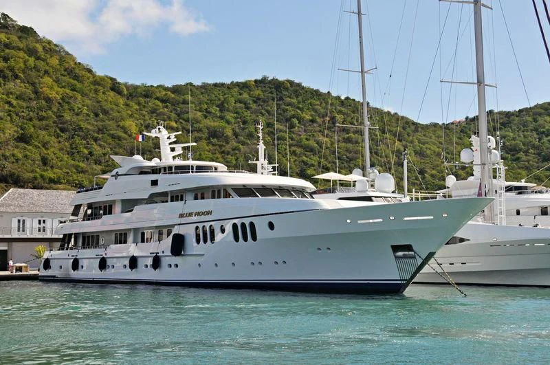 a large white boat in the water aboard BLUE MOON Yacht for Charter