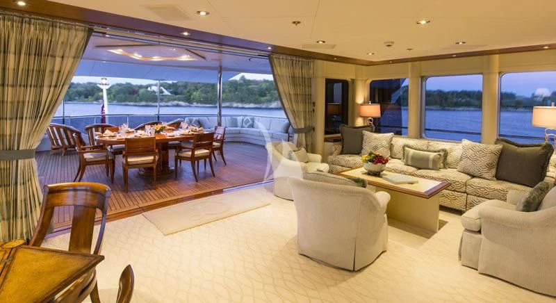 a living room with a couch and a table aboard BLUE MOON Yacht for Charter