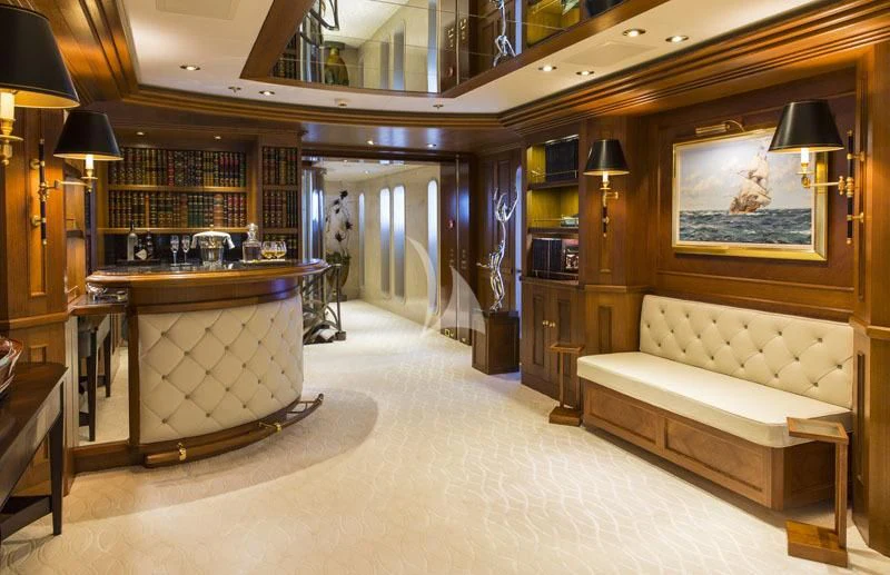 a large room with a couch and a table aboard BLUE MOON Yacht for Charter