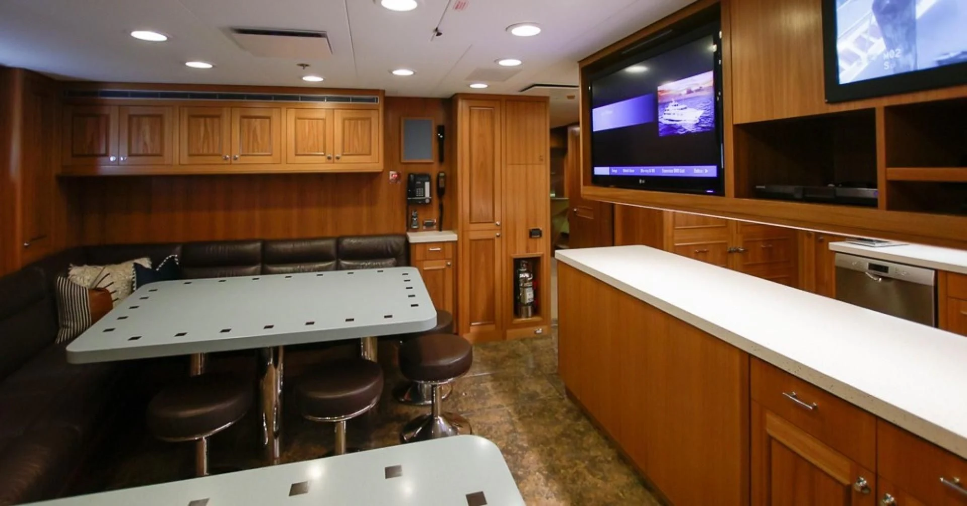 a kitchen with a large island aboard BLUE MOON Yacht for Charter