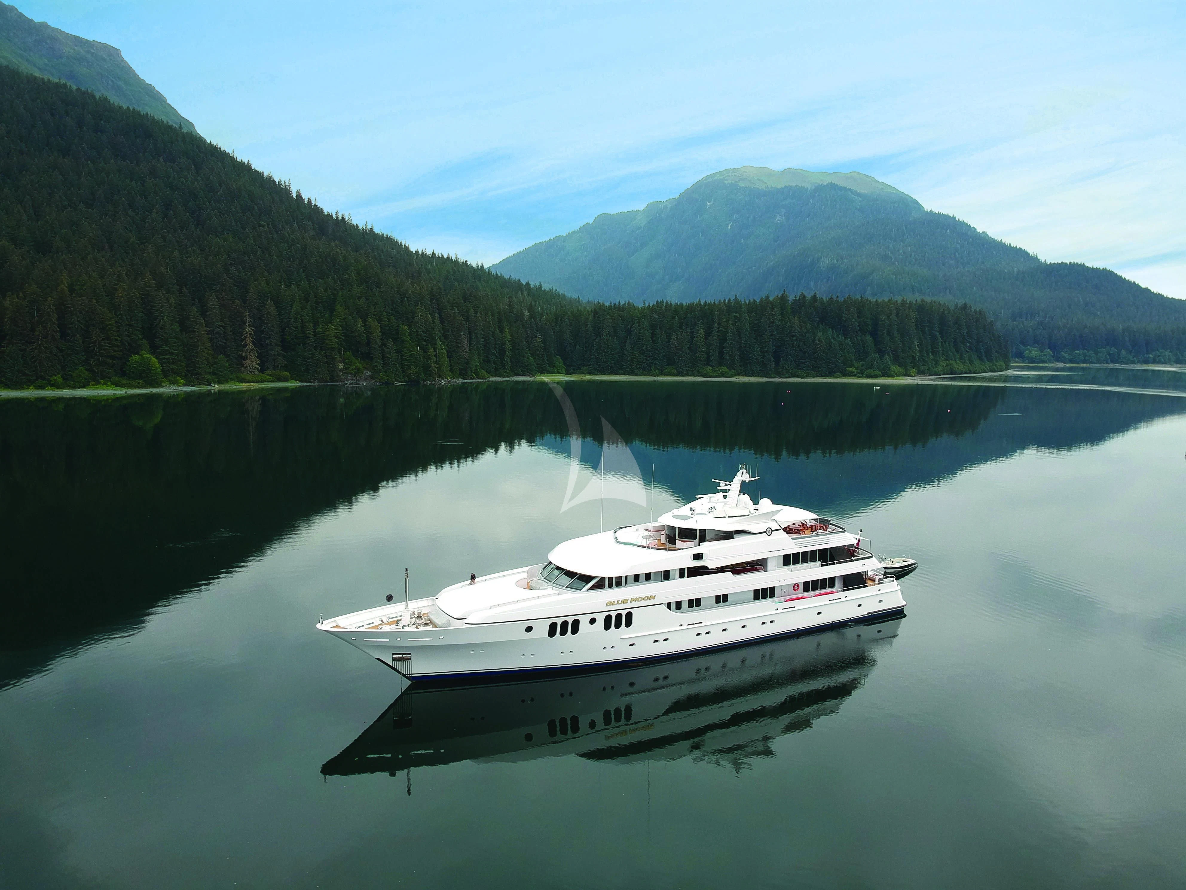 a boat on a lake aboard BLUE MOON Yacht for Charter