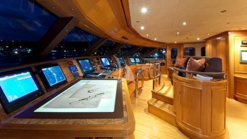 a room with a table and chairs aboard BLUE MOON Yacht for Charter