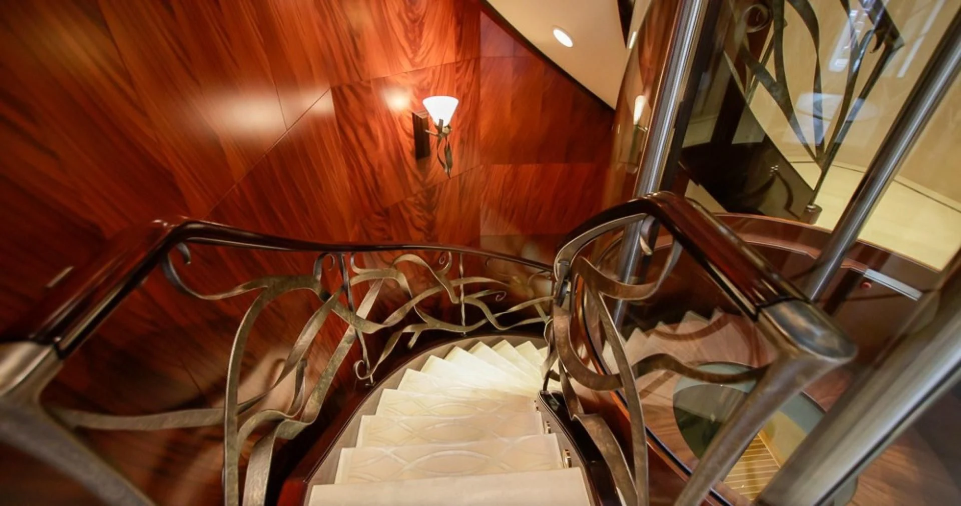 a staircase with a railing aboard BLUE MOON Yacht for Charter