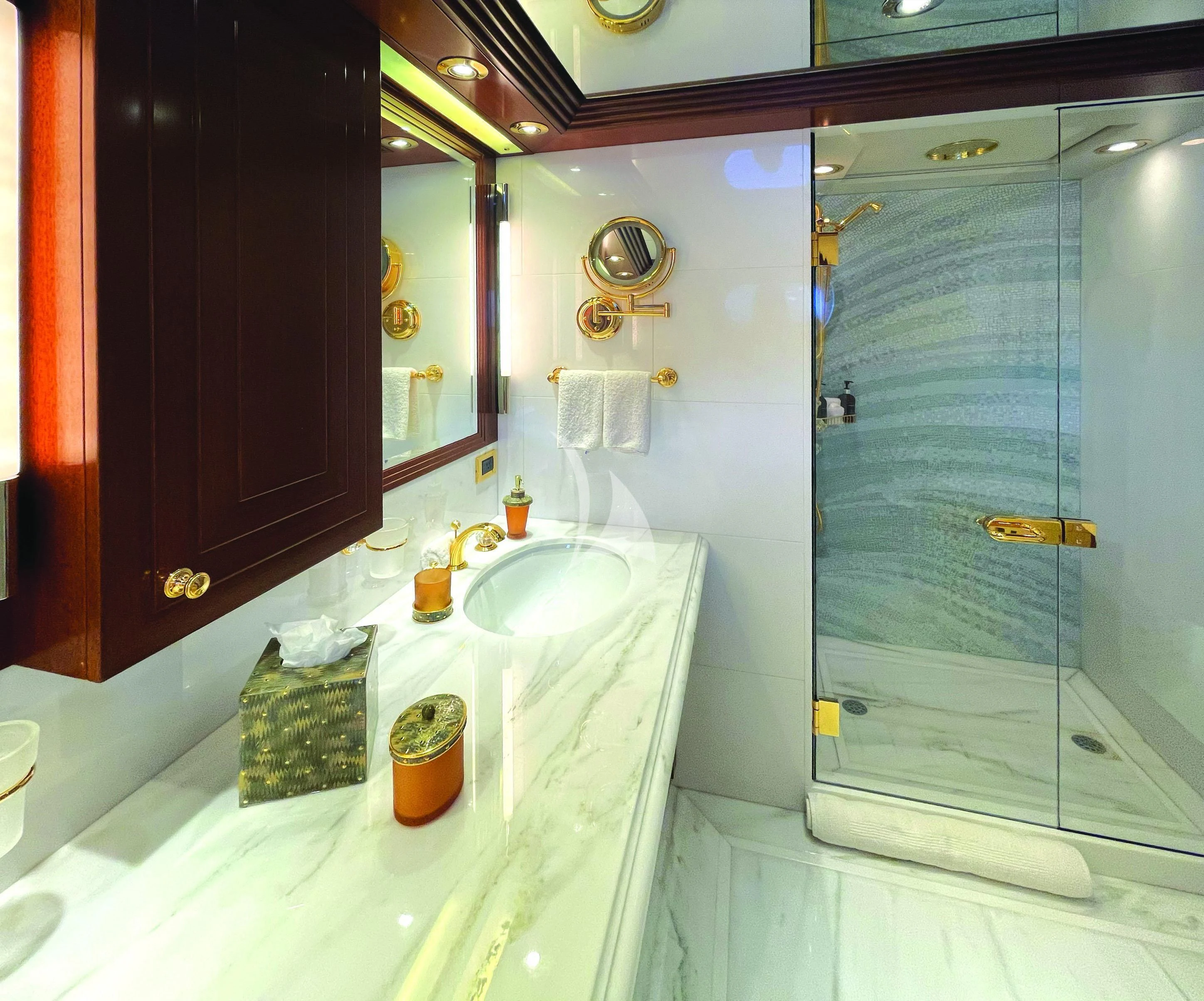 a bathroom with a glass shower aboard BLUE MOON Yacht for Charter