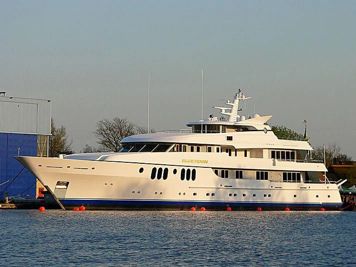 a large white boat in the water aboard BLUE MOON Yacht for Charter