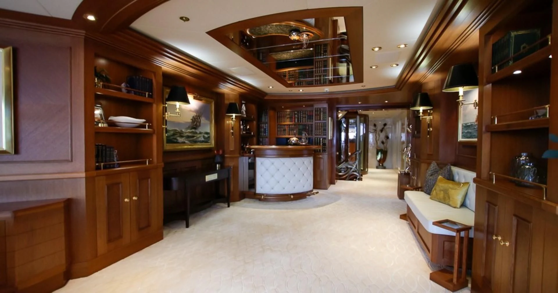 a room with a couch and a piano aboard BLUE MOON Yacht for Charter