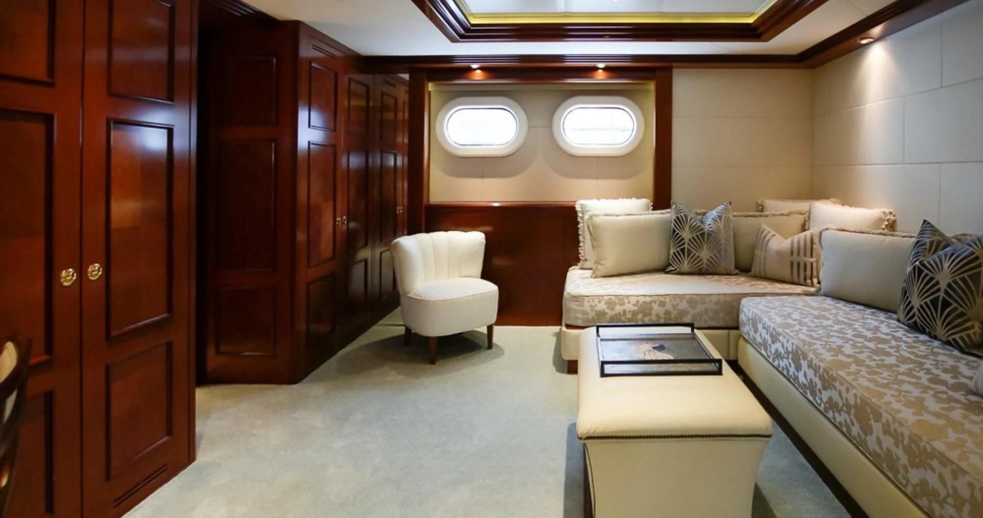 a room with a couch and a chair aboard BLUE MOON Yacht for Charter
