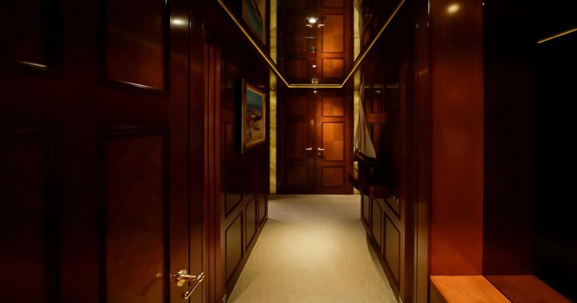 a hallway with a row of doors aboard BLUE MOON Yacht for Charter