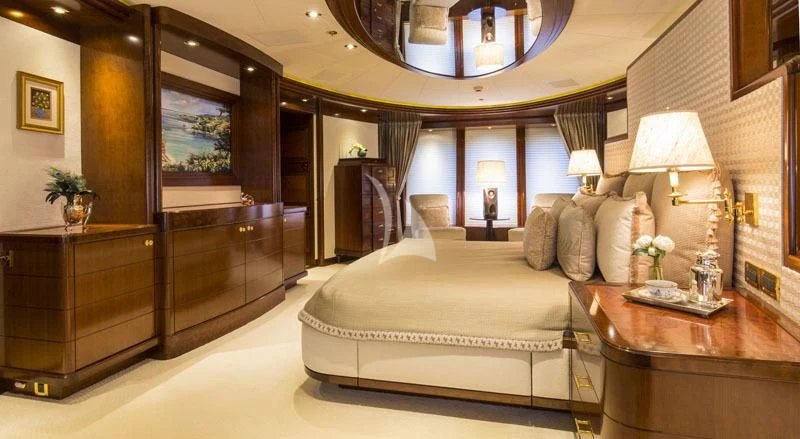 a large living room with a large mirror aboard BLUE MOON Yacht for Charter