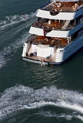 a large ship in the water aboard BLUE MOON Yacht for Charter