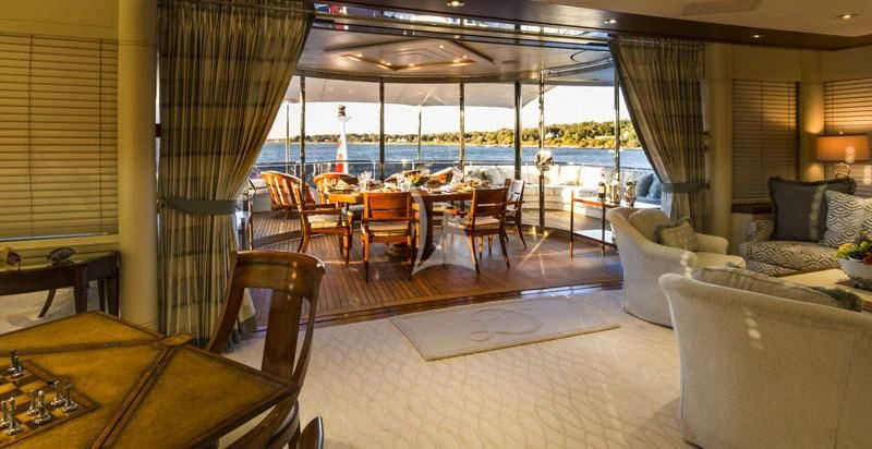 a room with a large balcony aboard BLUE MOON Yacht for Charter
