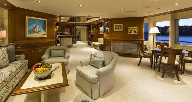 a living room with a couch and a table aboard BLUE MOON Yacht for Charter