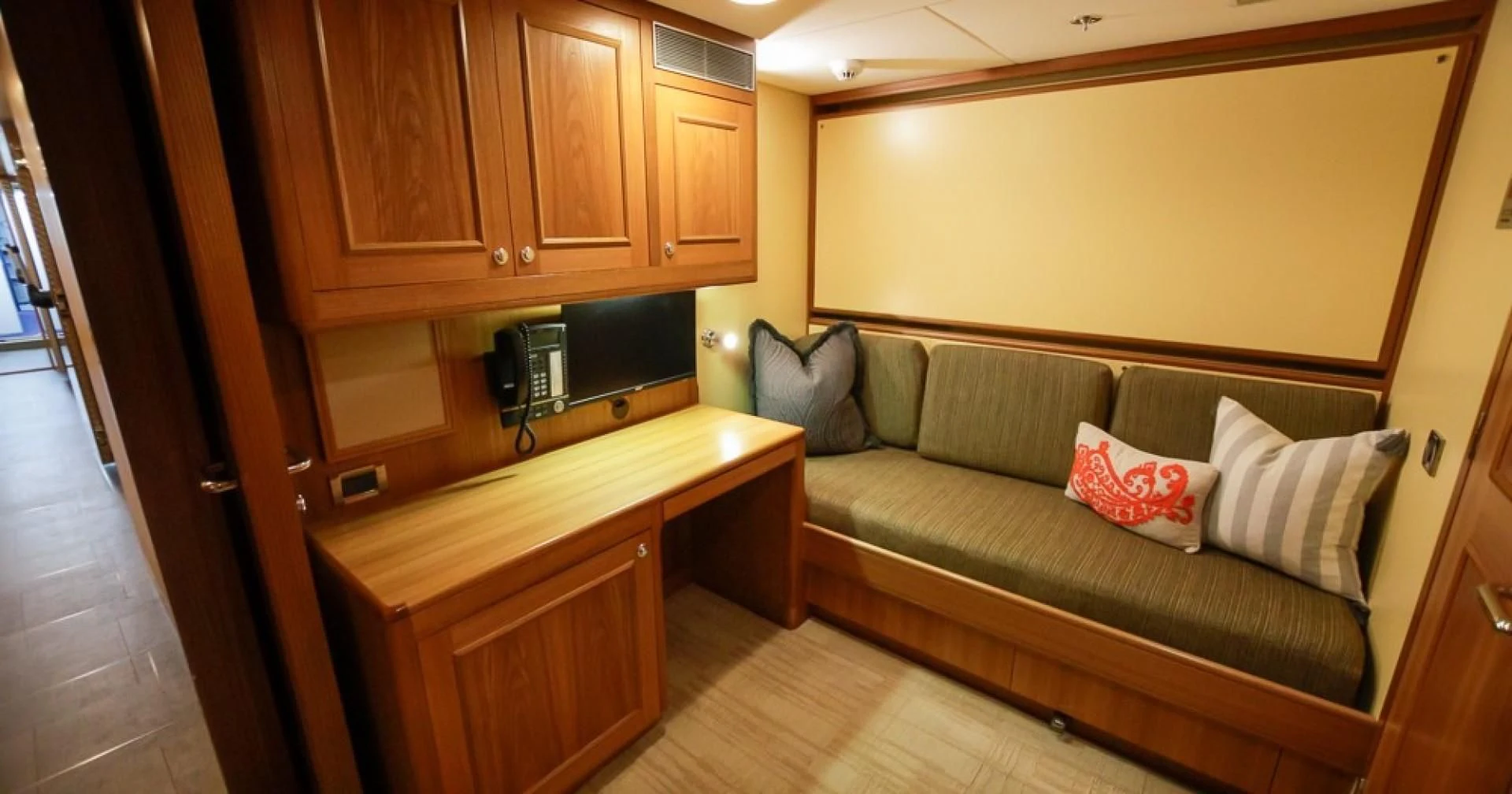 a couch and a television in a room aboard BLUE MOON Yacht for Charter