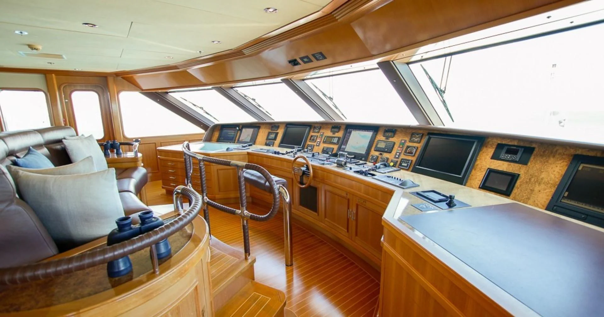 a boat with a desk and a couch aboard BLUE MOON Yacht for Charter