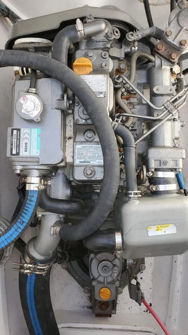a car engine with a blue cable aboard BLUE MOON Yacht for Charter