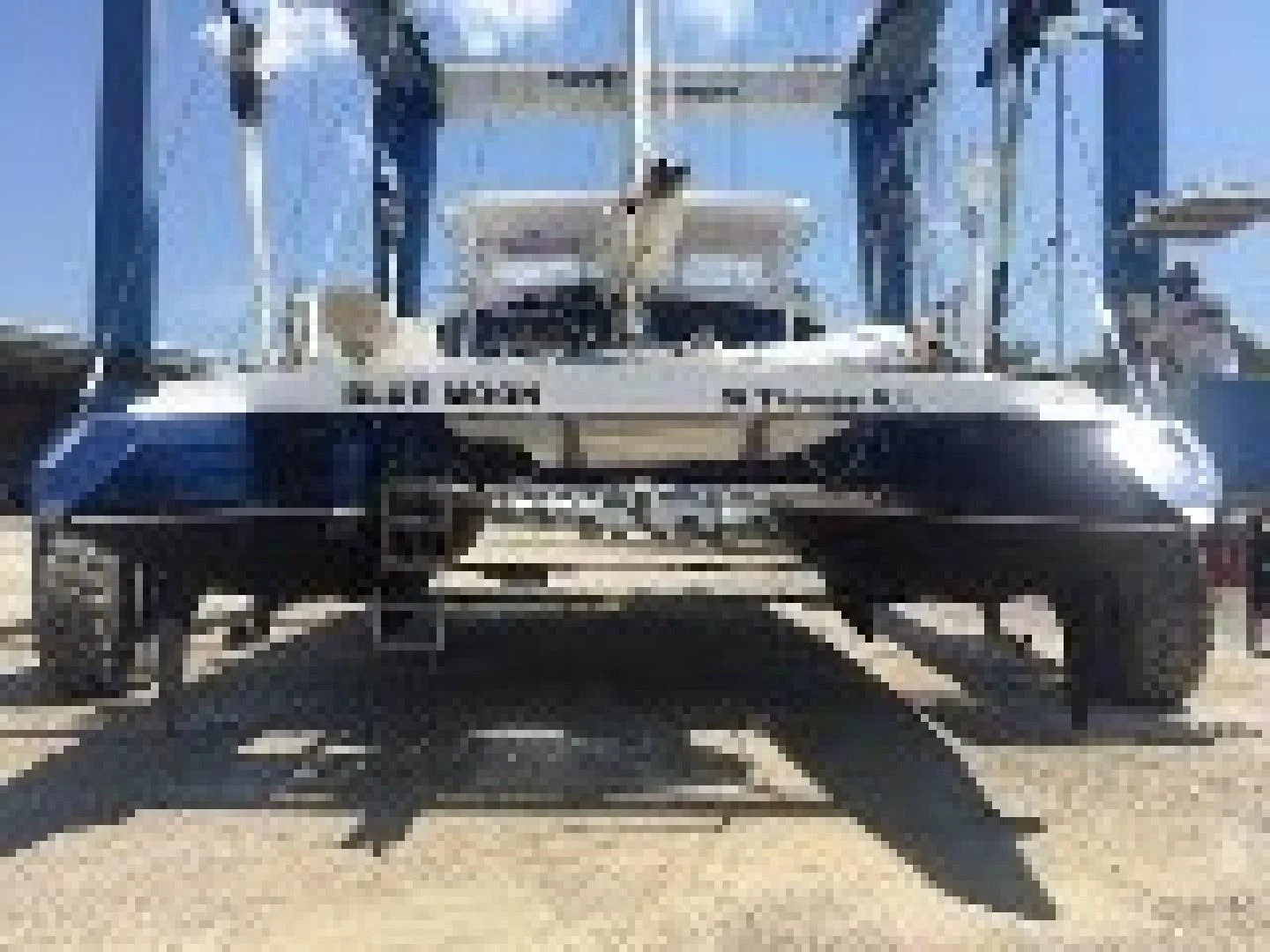 a large ship in a harbor aboard BLUE MOON Yacht for Charter