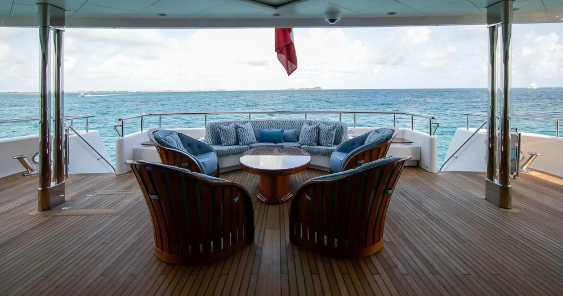 a living room with a large window overlooking the ocean aboard BLUE MOON Yacht for Charter
